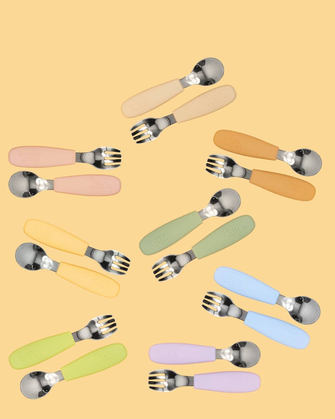 A set of silicone utensils, including a fork and spoon, in various soft pastel colors.