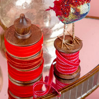 Red Grosgrain Ribbon on Wooden Spool