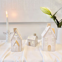 Lucia Snow House with Lights