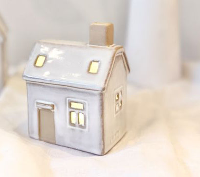 Lucia Snow House with Lights