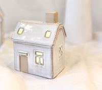 Lucia Snow House with Lights