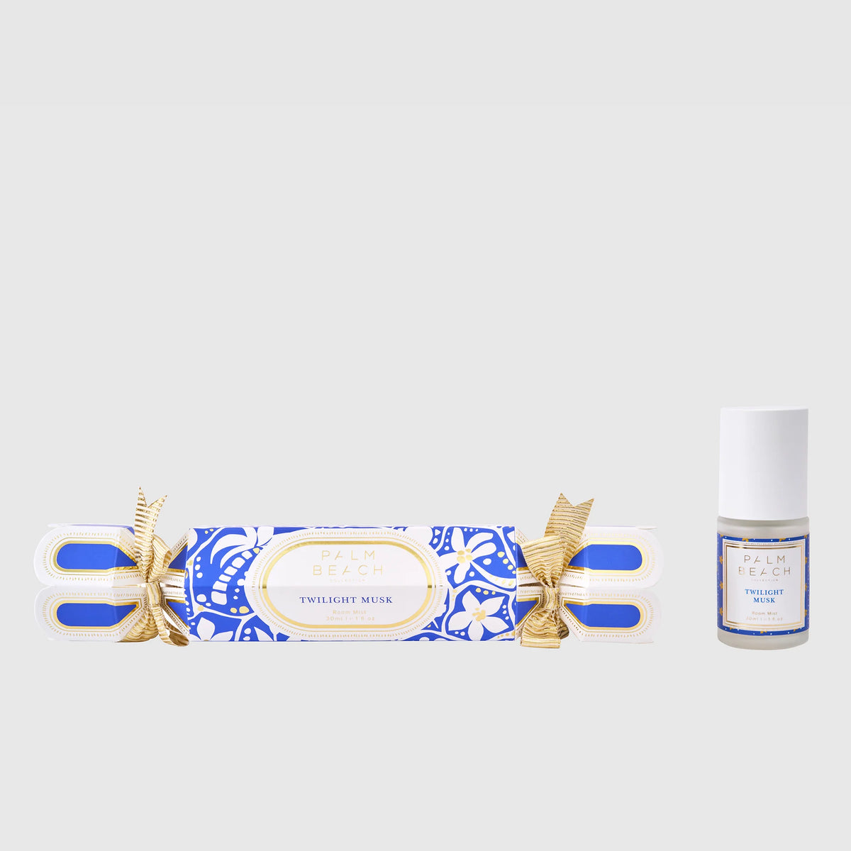 Twilight Musk incense stick and a small bottle of perfume on a light gray background