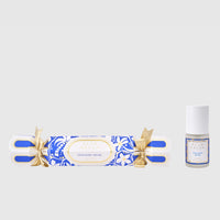 Twilight Musk incense stick and a small bottle of perfume on a light gray background