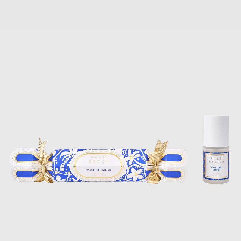 Twilight Musk incense stick and a small bottle of perfume on a light gray background