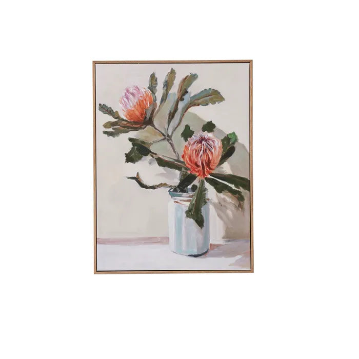 Framed artwork of a floral arrangement with pink flowers and green leaves on a white background