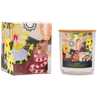 Candle with decorative packaging featuring floral and abstract designs including a snake and hibiscus flowers, and 'Frankie Gusti' branding.