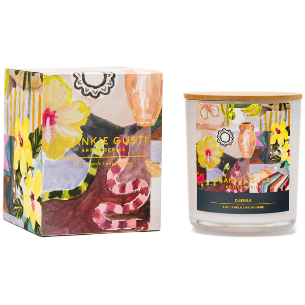 Candle with decorative packaging featuring floral and abstract designs including a snake and hibiscus flowers, and 'Frankie Gusti' branding.