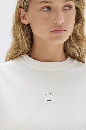 Assembly Label | White Exhibit Patch Short-Sleeve Tee