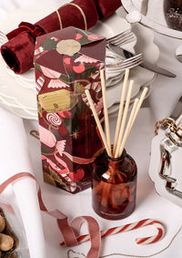 Decorative diffuser with floral packaging on a festive background