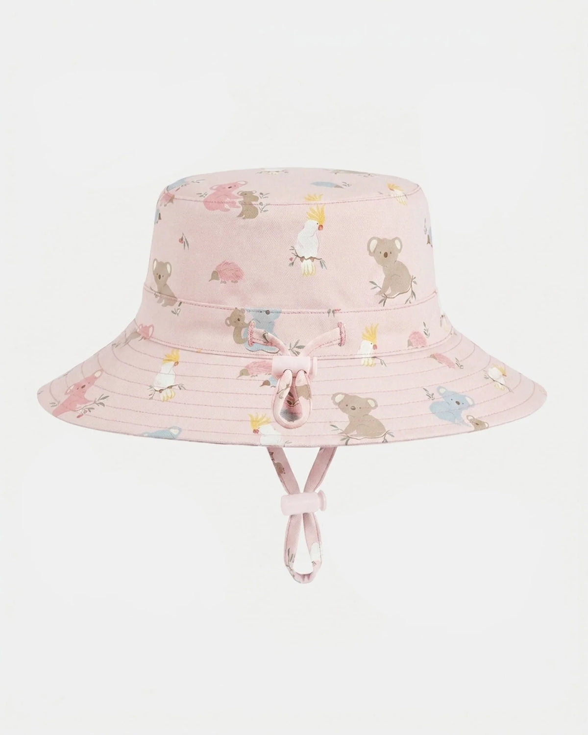 A light pink bucket hat with a playful animal print featuring koalas, kangaroo rats, and small flowers, complete with a matching chin strap and bow.
