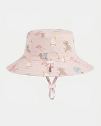 A light pink bucket hat with a playful animal print featuring koalas, kangaroo rats, and small flowers, complete with a matching chin strap and bow.