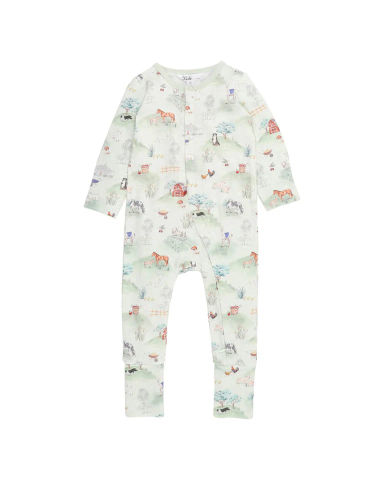 Children's onesie with a farm print on a white background. Features horses and barns.