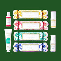 Collection of Palm Beach Fragrance products including bars and bottles on a green background