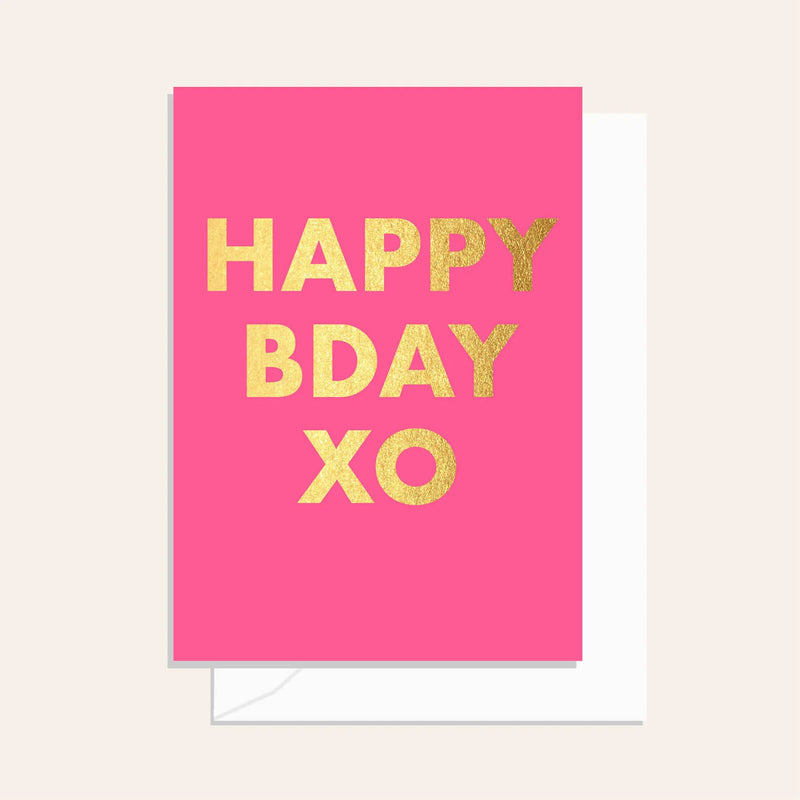 Pink card with gold text 'Happy Birthday XO' on a pink background