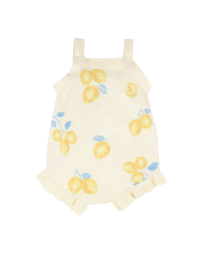 Yellow romper with floral pattern on a white background