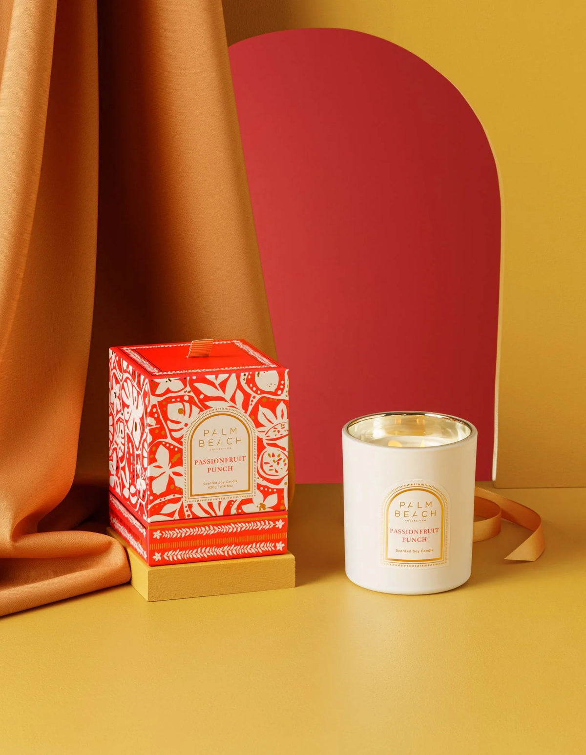 Candle and packaging on a yellow background