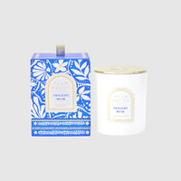 Candle and packaging with 'Twilight Musk' label on a light gray background